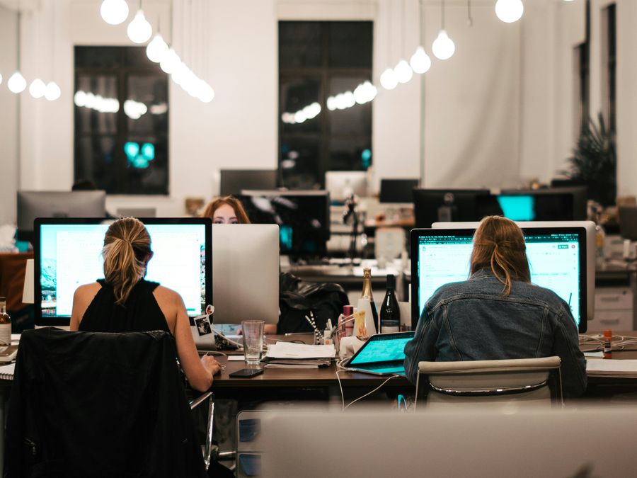 Insurance broking team working in an office